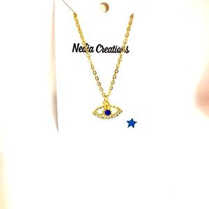 Rhinestone eye charm necklace.